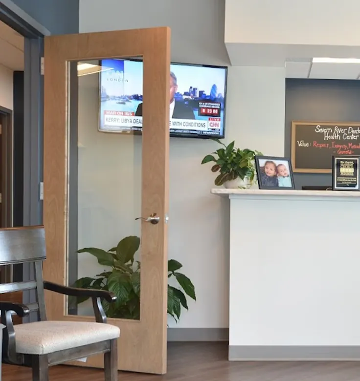 The reception desk and waiting area at Severn River Dental Health Center.